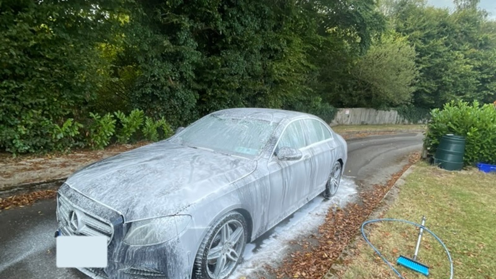 A Mercedes covered in snow foam on a Wicklow driveway