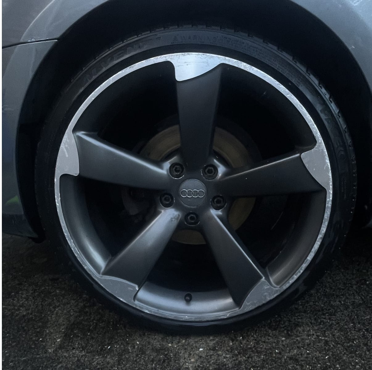 a cleaned alloy wheel after detailing